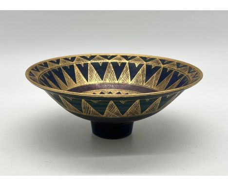 A Mary Rich ceramic bowl with gilt geometric patterns on a blue ground, signed to base 18cm diameter 