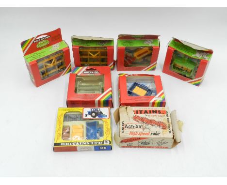 Eight Britains boxed farm machinery and accessories models, comprising of Acrobat Rake (9537), two Bomford Heavy Cultivators 