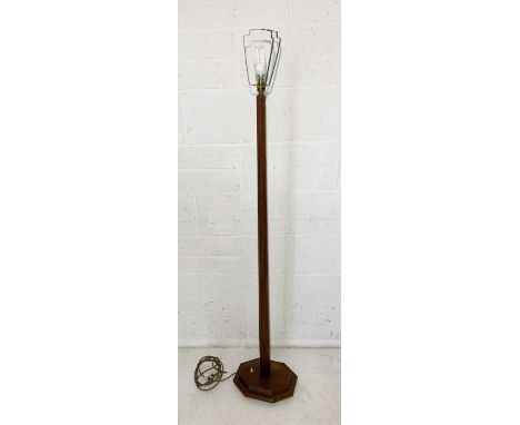 An Art Deco style oak standard lamp on stepped octagonal base 