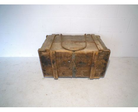 A rustic pine storage trunk.