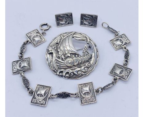 A Scandinavian style hallmarked silver brooch, bracelet and earrings, all depicting a longship