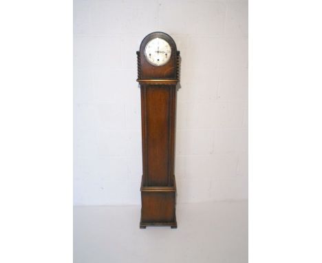 An oak cased grandmother clock, with carved decoration, the dial marked 'Enfield', height 140cm.