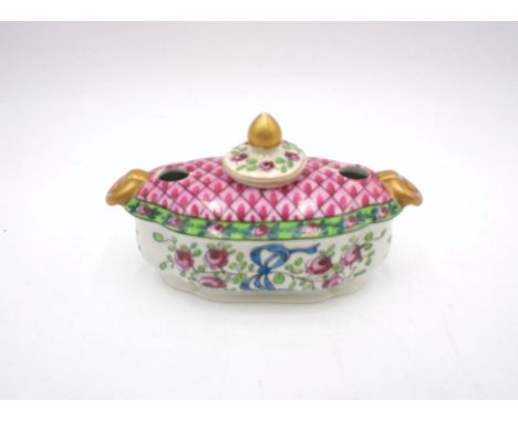A continental ceramic inkwell.