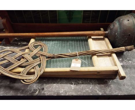 A vintage copper wash dolly and two glass and wood wash boards together with a carpet beater