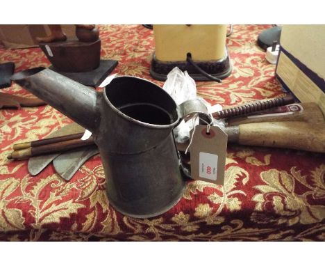 A gun cleaning rod, two bill hooks and a vintage oil can