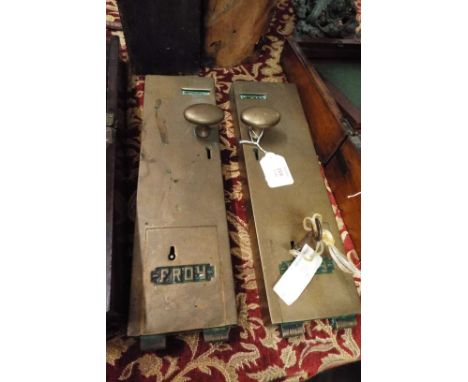 A pair of vintage heavy brass toilet penny collectors