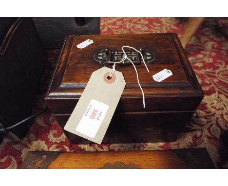A mahogany caddy box with brass fitted handle and lined interior with removable tray