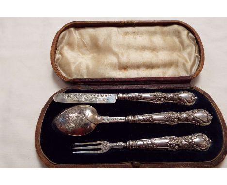 A George Unite silver child's christening set of knife, fork and spoon, the handles with ornate floral design, in fitted case