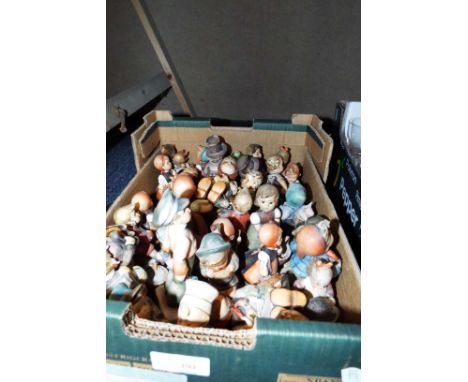 A large selection of Hummel figurines for restoration
