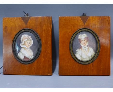 Late 19th century Continental school, pair of oval portrait miniatures of ladies wearing white bonnets, in matching frames, 9