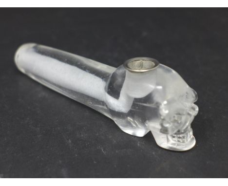 A crystal quartz opium pipe with carved skull decoration 