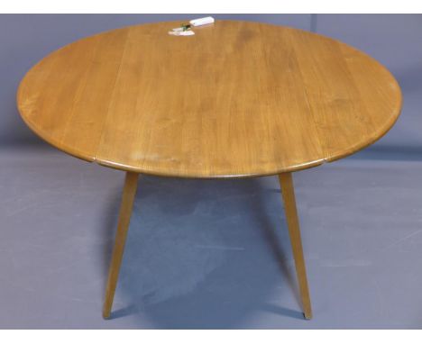 An Ercol elm and beech drop leaf table, raised on splayed legs, H.73 L.112cm 