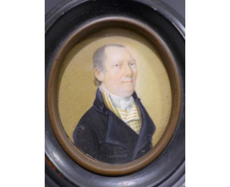 August Lutz, an oval portrait miniature of a gentleman in black coat with white waistcoat with yellow stripes and white crava