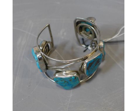 A Continental pierced silver bangle set with turquoise, marked 925 