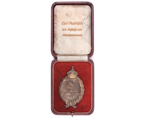 A WWI Imperial German Air Force breast badge, in its case, lid marked “Carl Poellath K B Holfigrant Schrabenhusen”.          