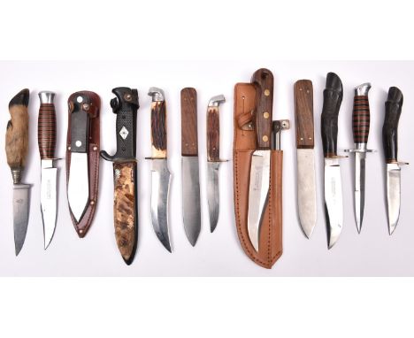 2 fishermens” knives in sheaths; a hunting knife with goat's hoof grip; 2 similar with carved hoof grips; 7 other small hunti