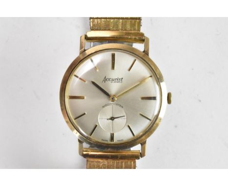 An Accurist, manual wind, gents, 9ct gold wristwatch, having a silvered dial, subsidiary seconds dial and baton hour markers,