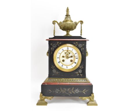 A late 19th century French marble mantle clock, the case having gilt metal urn finial and applied scroll handles, engraved fl