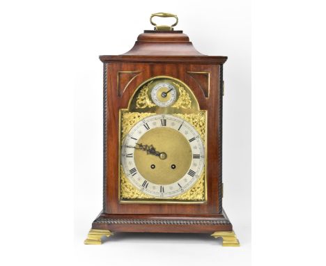 A late 19th/early 20th century mahogany 8 day mantle clock, the case having an inverted bell top with cast brass handle, gadr