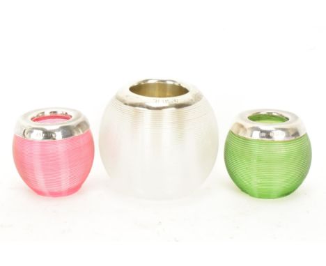 Three early 20th century silver topped globular table vesta/match strikers, in clear, green and ruby glass, hallmarks for Bir
