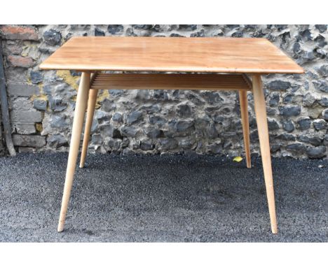 A 1960s Ercol blonde elm and beech breakfast table, model 395, having a rectangular top with a spindle shelf below and four t