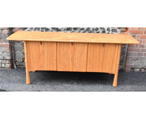A rare 20th century Ercol Saville elm sideboard The oversized plank top raised over a ridged base fitted with cupboard doors 