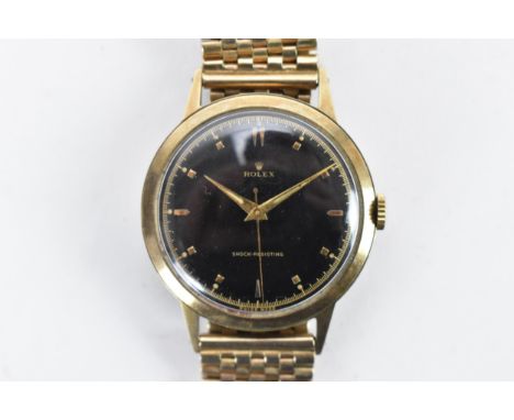 A Rolex, manual wind, gents, 9ct gold wristwatch, circa 1937, having a black dial, centre seconds, gilt baton markers and han