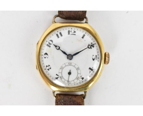 A 1920s, manual wind, gents, 18ct gold wristwatch, having a white enamel dial, subsidiary seconds dial, Arabic numerals, blue