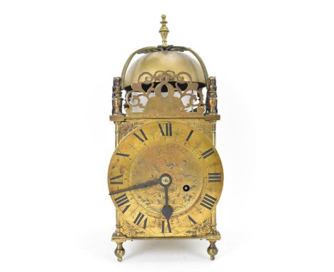 A circa 1900 Mappin &amp; Webb lantern clock, in the 17th century style, the brass case having a turned final, strap work bel