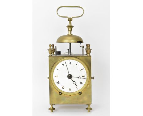 An early 19th century French capucine travel alarm clock, having a 3.5 inch white enamel dial with Roman numerals, brass case