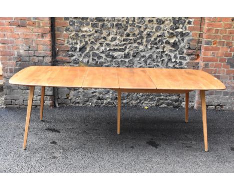 A vintage Ercol elm and beech extending dining table with one folding leaf, on four splayed square tapering legs, 71.5cm high