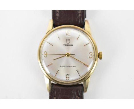 A Tudor, manual wind, gents, 9ct gold wristwatch, circa 1970s, having a silvered dial, centre seconds, Arabic and baton marke