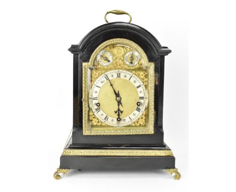 A late 19th century Winterhalder &amp; Hofmeier ebonised mantle clock, the arched top case having cast handle to the top, gil
