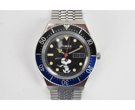 A Timex M79 X Peanuts, automatic, gents, stainless steel wristwatch, having a Snoopy masked marvel dial with, centre seconds,