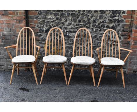 A set of four 1960s Ercol chairs blonde elm and beech 'Quaker' dining chairs, two being carvers, having hoop backs with spind