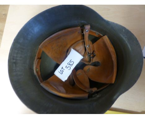 German military steel helmet with decals.
