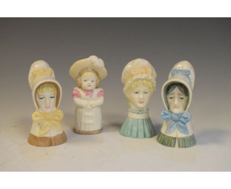 Four Royal Worcester candle snuffers comprising old woman, young girl, mobcap and feathered hat  