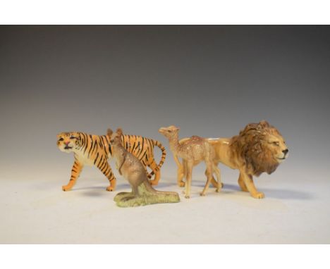 Four Beswick animal figures comprising Camel - Foal 1043, Lion - facing right 1506, Tigress - 1486 and Kangaroo 2312 (4)  