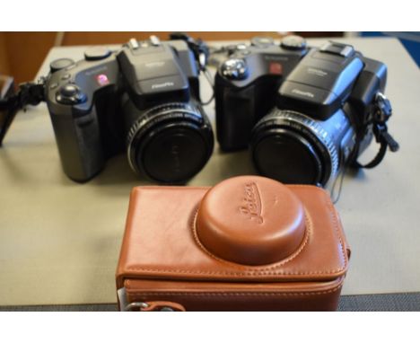 Assorted digital cameras and other camera-related accessories  
