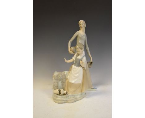 Nao figure of a maid collection water, 40cm high, together with a figure of a girl at a well, 29cm high  