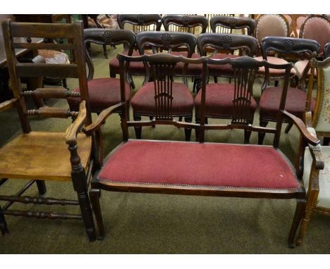 An oak ladder back armchair (replacement seat); and a mahogany settee with pierced splats (2) 