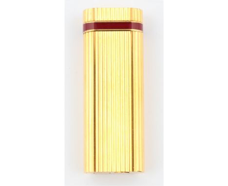 A boxed le Must de Cartier lighter, having textured body and red enamel detailing around lid. BOOK A VIEWING TIME SLOT ON OUR