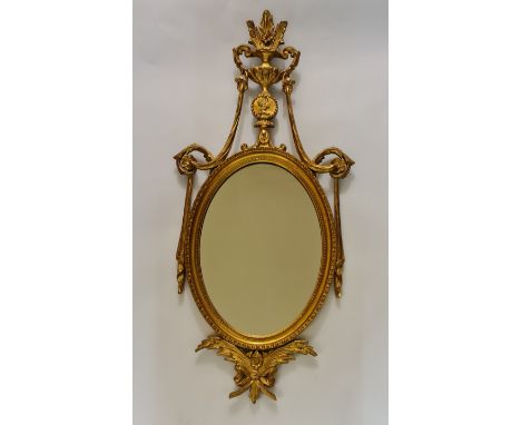 A late Eighteenth century French gilt mirror with wheat decoration, fleur de lis above ern to top and portrait in circle in m