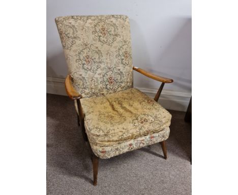 An Ercol armchair with upholstered seat and back. BOOK A VIEWING TIME SLOT ON OUR WEBSITE FOR THIS LOT. IMPORTANT: Online bid