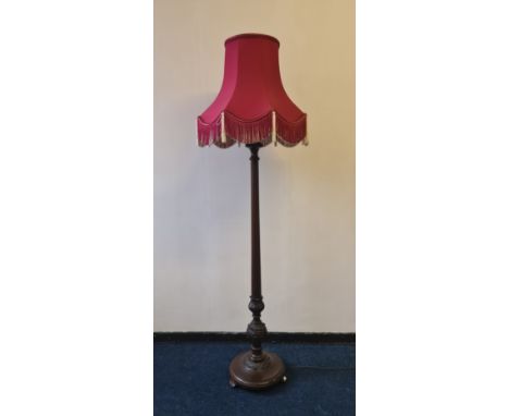 A mahogany carved base standard lamp with fluted column. IMPORTANT: Online viewing and bidding only. Collection by appointmen