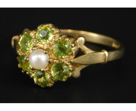 A 9ct gold dress ring, set in a floral cluster, with peridot and seed pearl, 2.4g all in. 