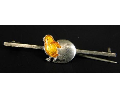 A bar brooch, with design of chick coming out an egg, in yellow enamel white metal, stamped Sterling, 2.1g all in. 
