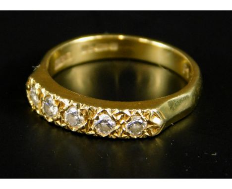 An 18ct gold diamond dress ring, set with five illusion set diamonds, 3.5g all in.