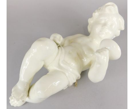 A Spanish ceramic wall mounting putto, holding a glass or goblet, 44cm high