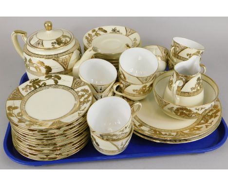 A Noritake porcelain part tea service, decorated in gilt on a blush ivory type ground to include teapot and cover.